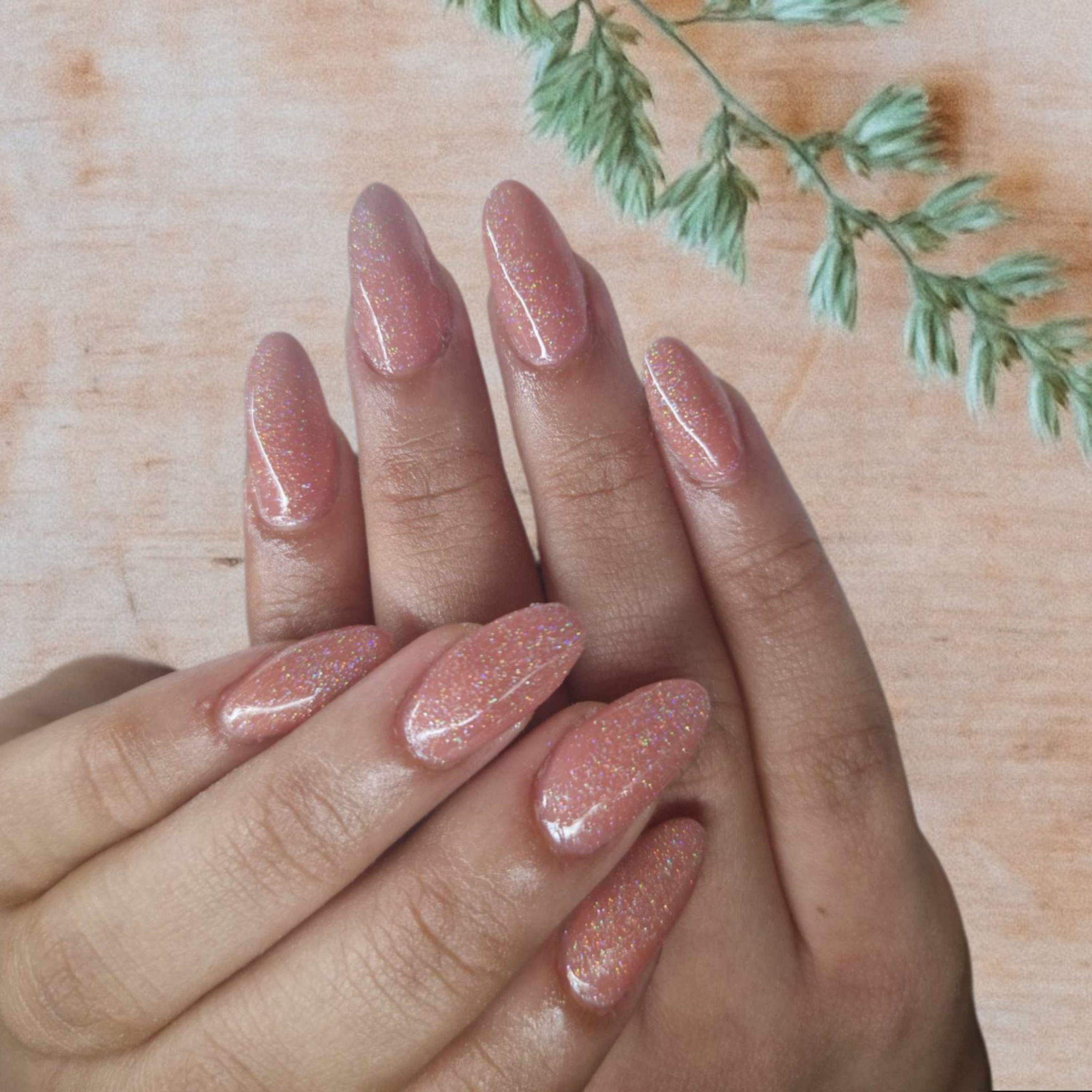 pink-nails-on-a-desk-with-flowers
